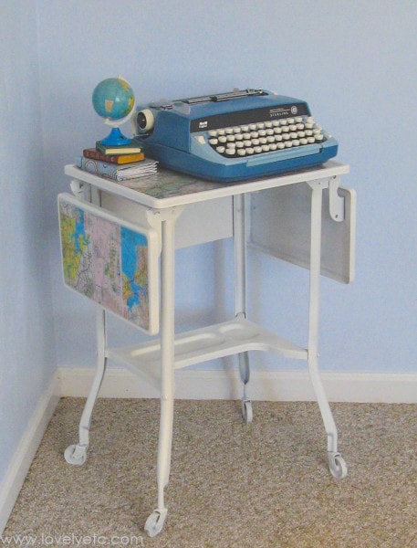 vintage blue typewriter and painted typewriter stand