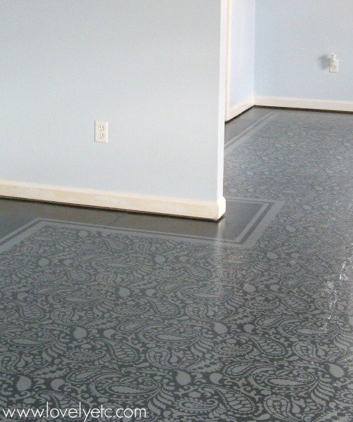 painted plywood subfloor with stenciled pattern and painted border