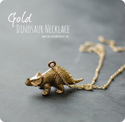 Gold dinosaur necklace