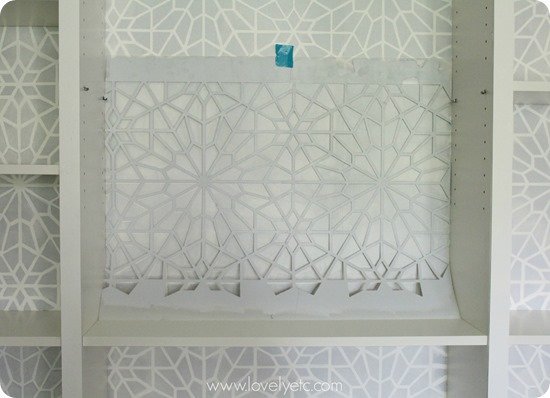 stenciling a bookcase backing