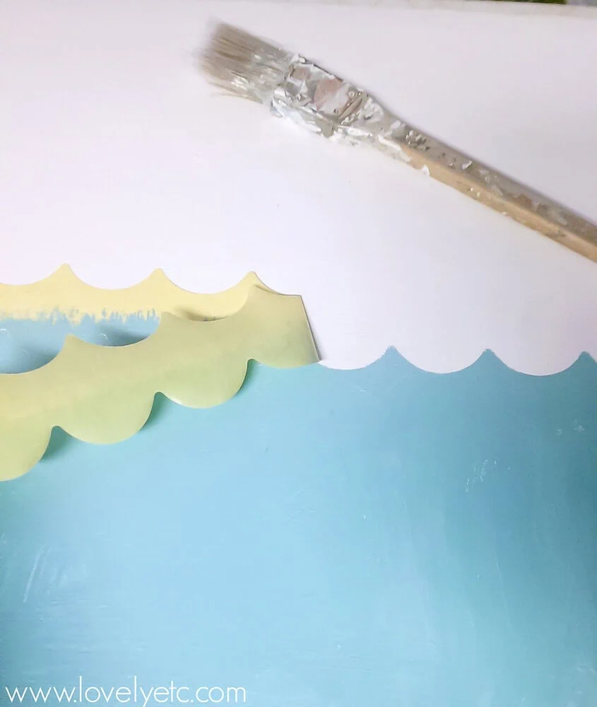 using shape tape to paint waves.