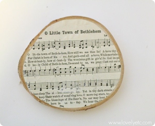 O Little Town of Bethlehem music attached to a wood slice.