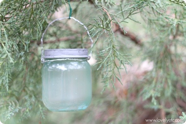 mini mason jar ornament hanging on Christmas tree.