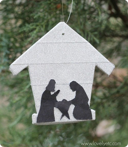 DIY ornament with stable background and silhouette of Mary and Joseph.