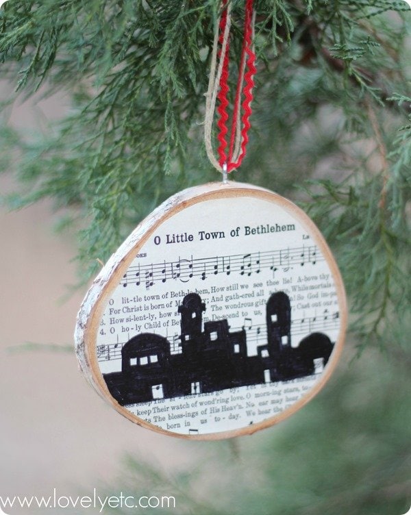 o little town of bethlehem ornament hanging on Christmas tree.