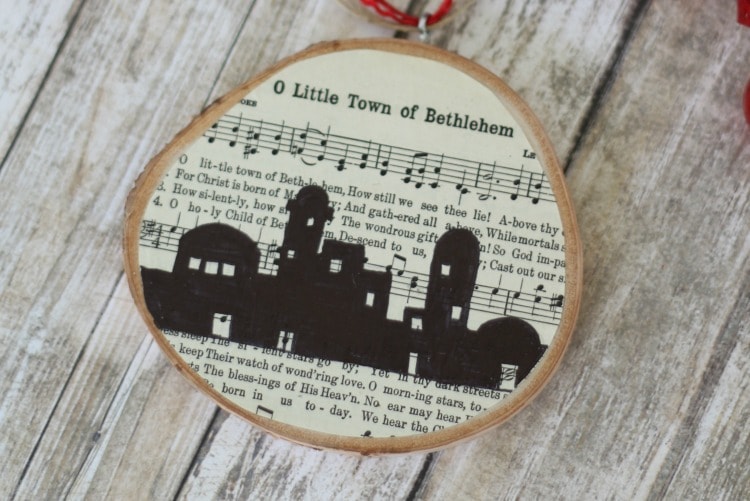 O little Town Of Bethlehem ornament with sheet music on wood slice ornament.