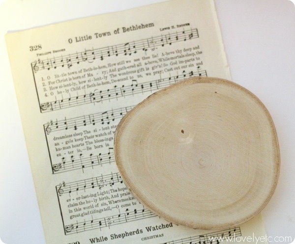 o little town music sheet with wood slice.