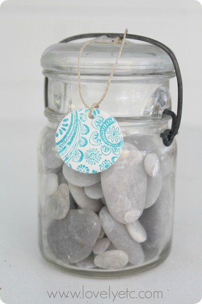 stamped clay tag on jar