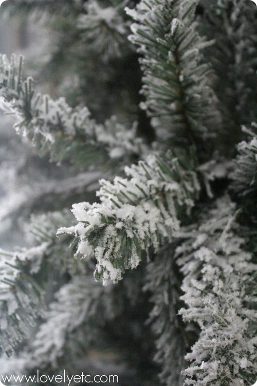 Gorgeous flocked Christmas tree - instructions to flock your own Christmas tree. You can flock a real tree or an artificial tree and it is much easier than you might think! close up of diy flocked Christmas tree