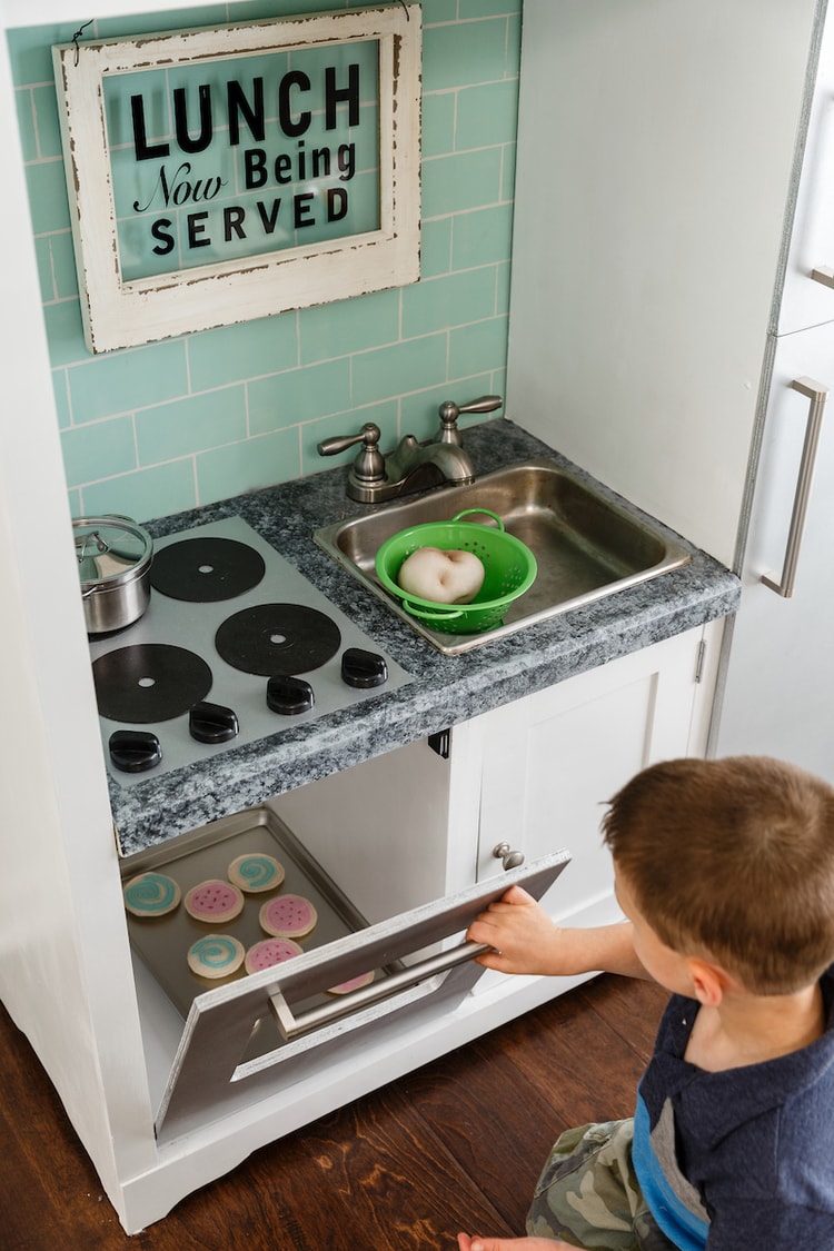 DIY play kitchen from an entertainment center Lovely Etc.
