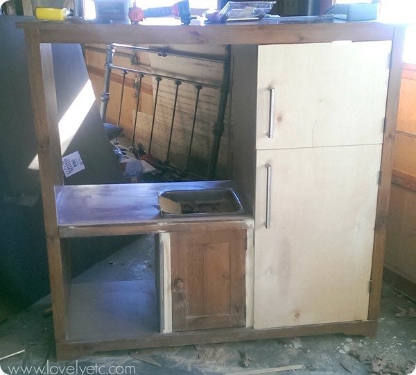 entertainment center reconfigured for play kitchen