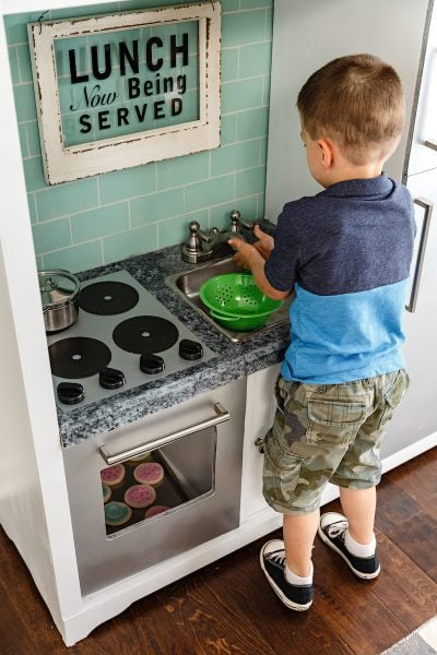 Fun DIY play kitchen made from an old entertainment center