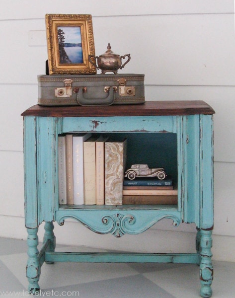 distressed furniture piece with books