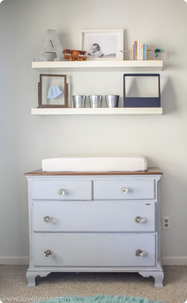 dresser with glass doorknobs and floating shelves