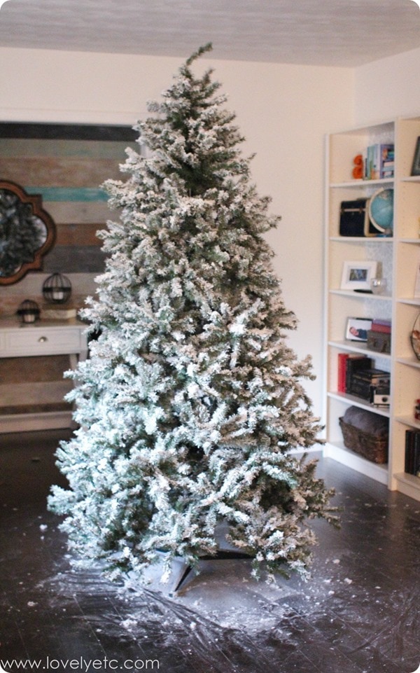 Messy floor after fluffing the branches and adding lights to my DIY flocked Christmas tree.