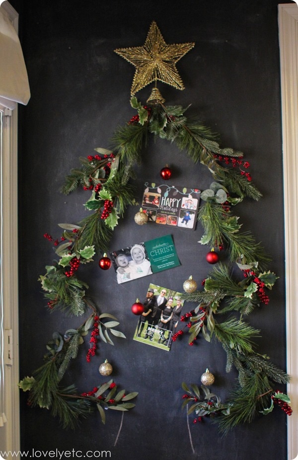 Christmas tree Christmas card display on wall.