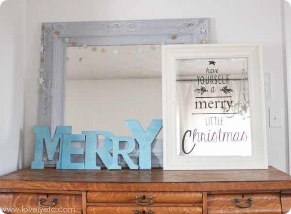 bright light Christmas vignette - with letters spelling Merry and a mirror with vinyl that says Have yourself a merry little Christmas.