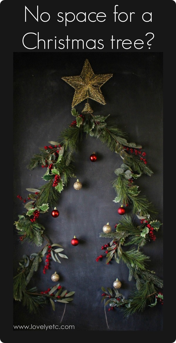 hanging Christmas tree on wall with star and ornaments.