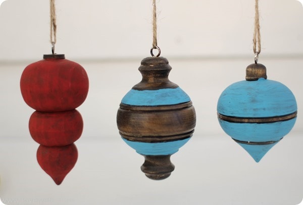 diy wooden ornaments painted with red and aqua chalk paint.