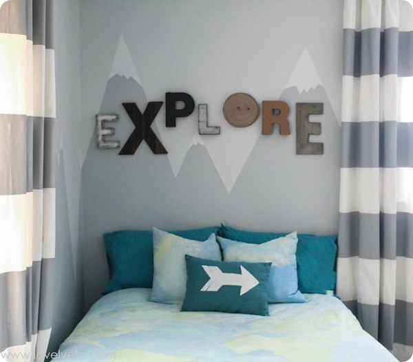 explore sign and mountain mural