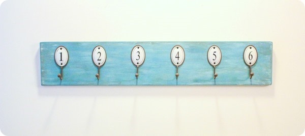 numbered towel hooks on wood