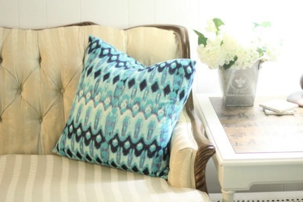 DIY pillow cover made from a cute patterned thrift store dress.