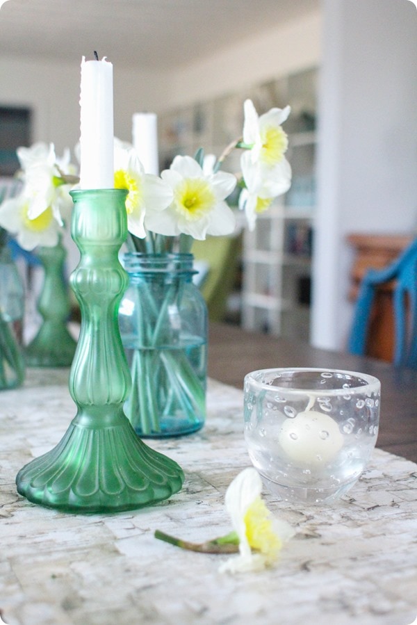 green candlestick and mason jar vase