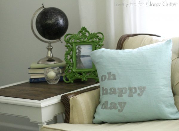 throw pillow stenciled with the words oh happy day