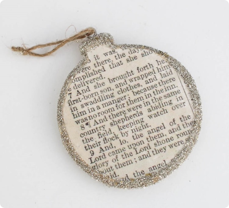 Ornament with Bible story attached to front and glitter around the edges.