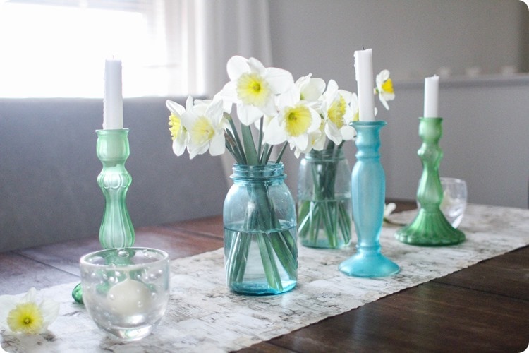 table runner on table with mason jars and candles