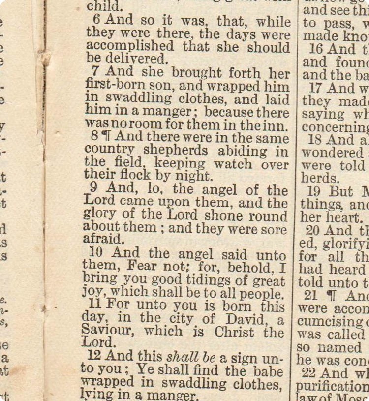 luke 2:6-12 pictured in antique Bible.