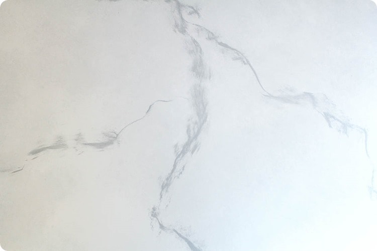 painting gray marble on a white countertop