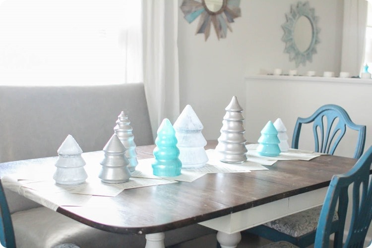 Christmas tablescape made from painted glass Christmas tree jars.