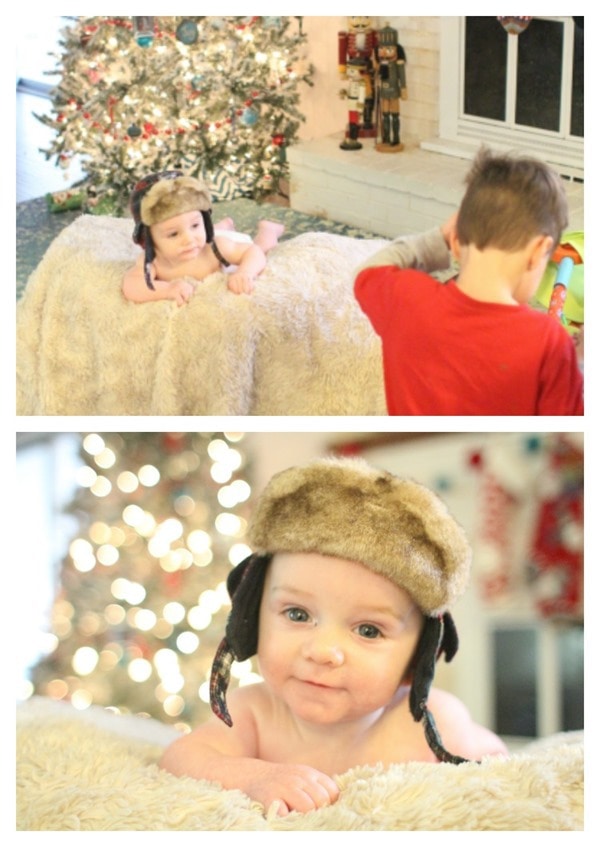 set up for taking a small baby's photo in front of the Christmas tree.