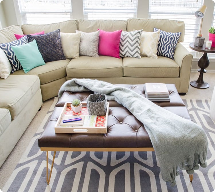 covering an old sofa with pillows.