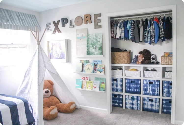 kids room with play tent, gallery wall, and organized closet