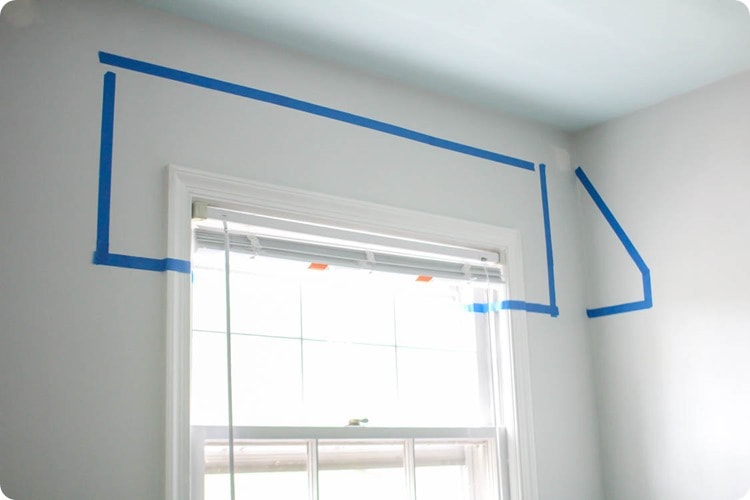 deciding on size of window awnings using painters tape