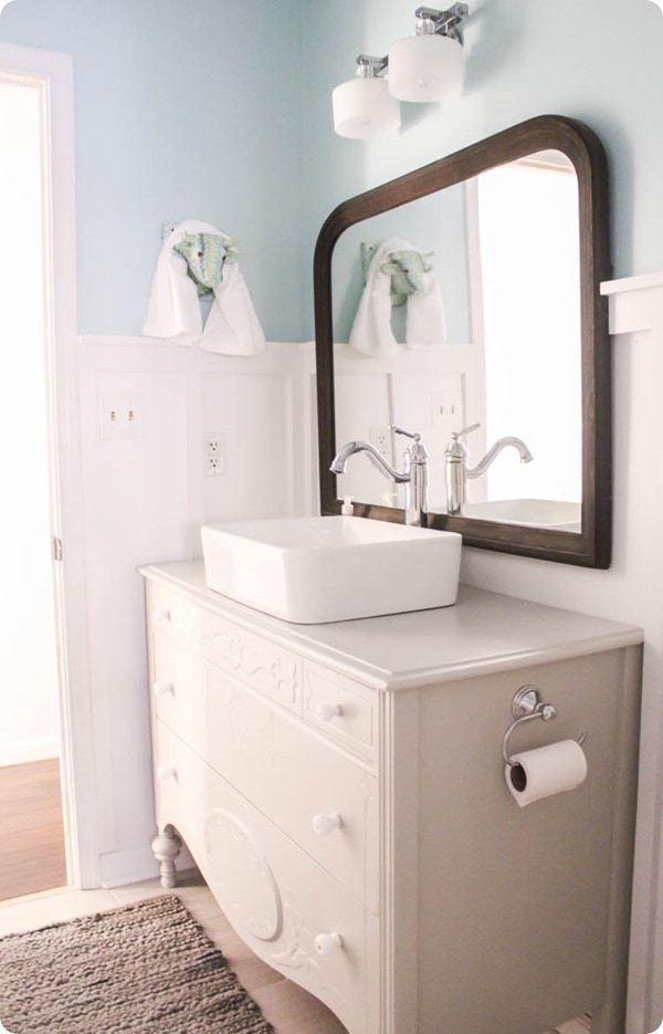 dresser vanity with vessel sink and vintage mirror