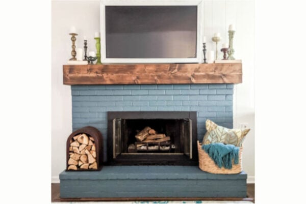 DIY rustic fireplace mantel: the cure for a boring fireplace - Lovely Etc.