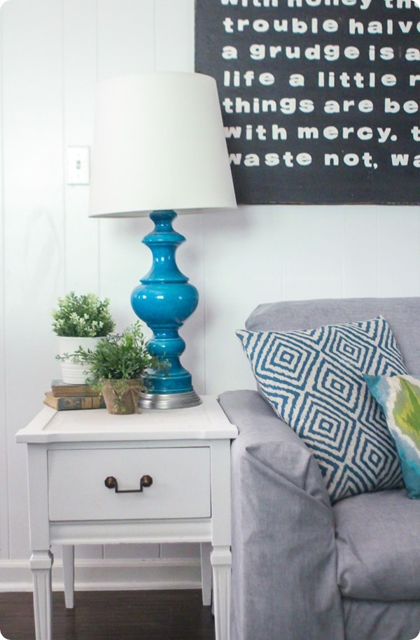 white end table with gray couch