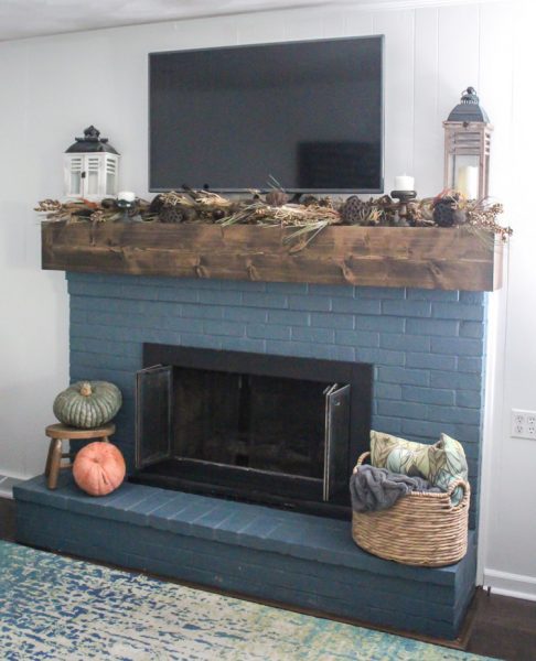 fall mantel with garland and pumpkins