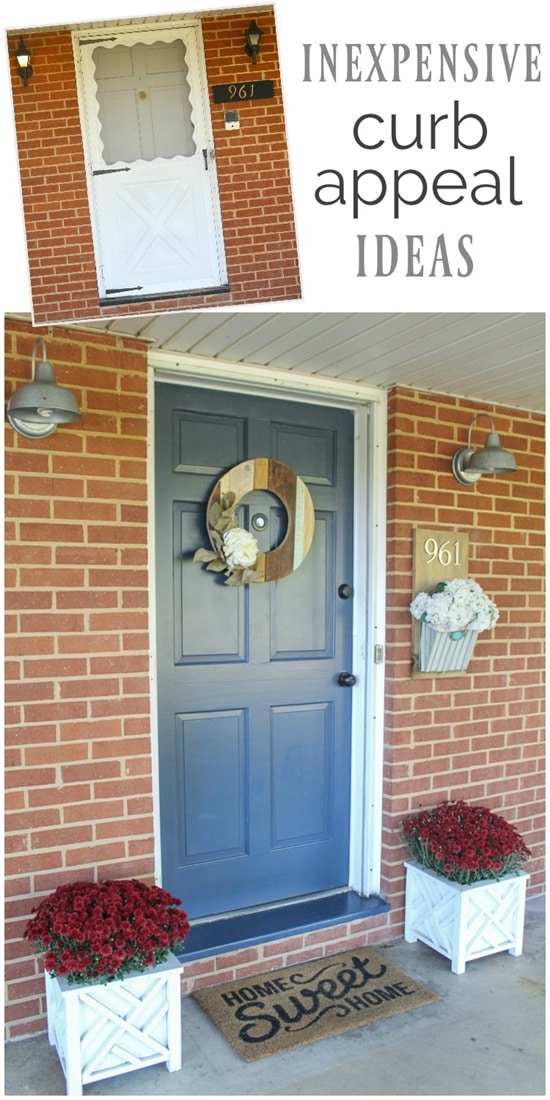 ugly brick ranch with blue front door and planters with wood wreath on door. 