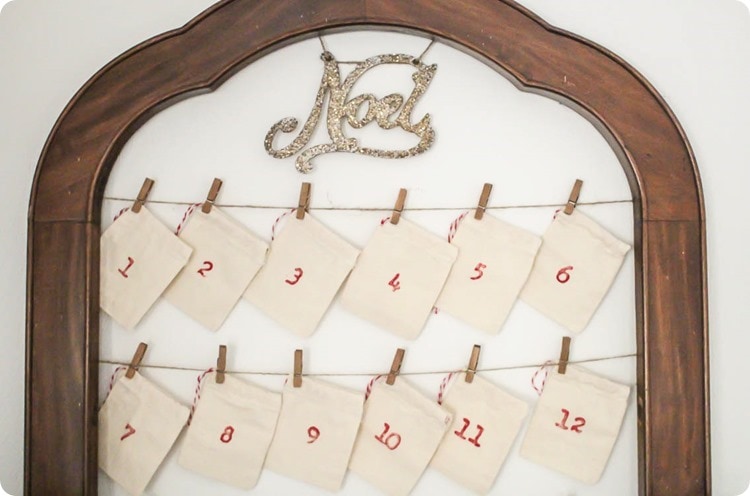 Simple diy reusable advent calendar with stamped canvas bags and sparkly Noel ornament.