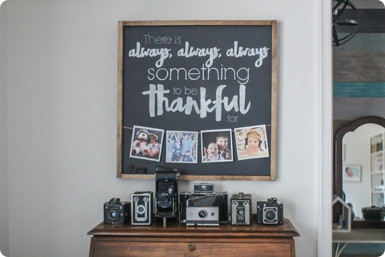 thankful sign with photos above collection of vintage cameras.