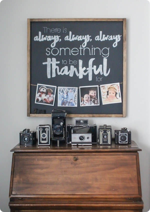 DIY thankful photo sign and vintage camera collection.