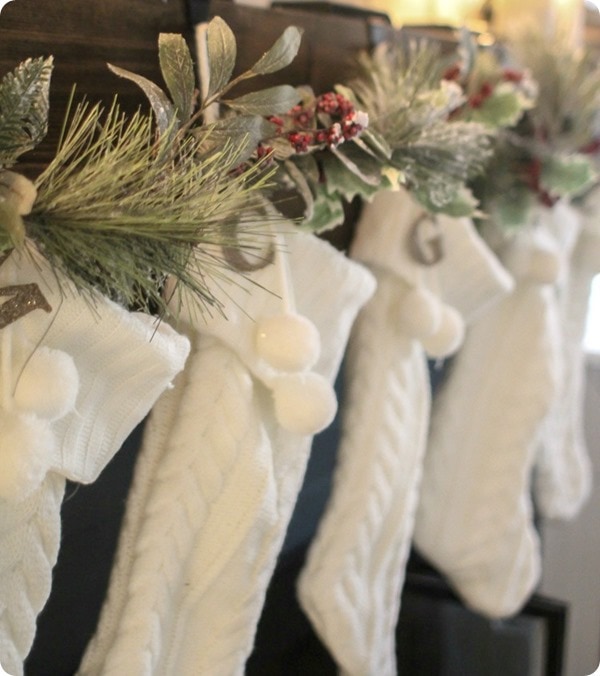 white cable knit stockings hanging on fireplace with glittered chipboard letters.