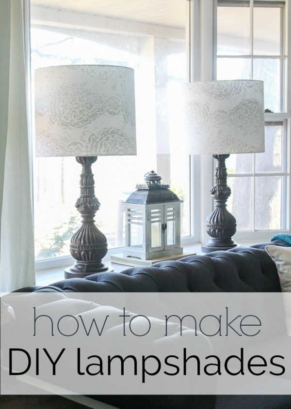 pair of wooden lamps behind couch with diy lampshades made from a neutral print fabric.