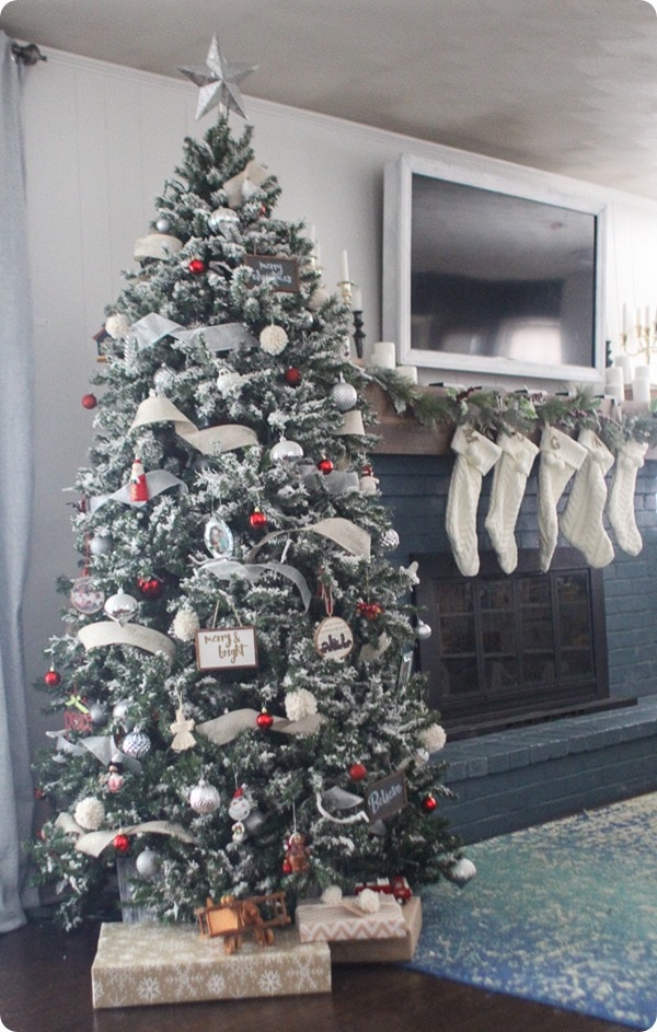 Modern take on a traditional red and white Christmas tree. With DIY flocking, beautiful ribbon, and lots of handmade ornaments.