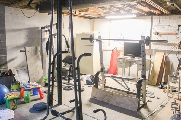 unfinished basement before home gym makeover