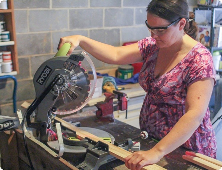 cutting the frame with a compound miter saw.